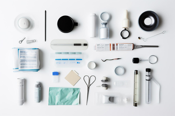 Medical supplies neatly arranged on a white surface.